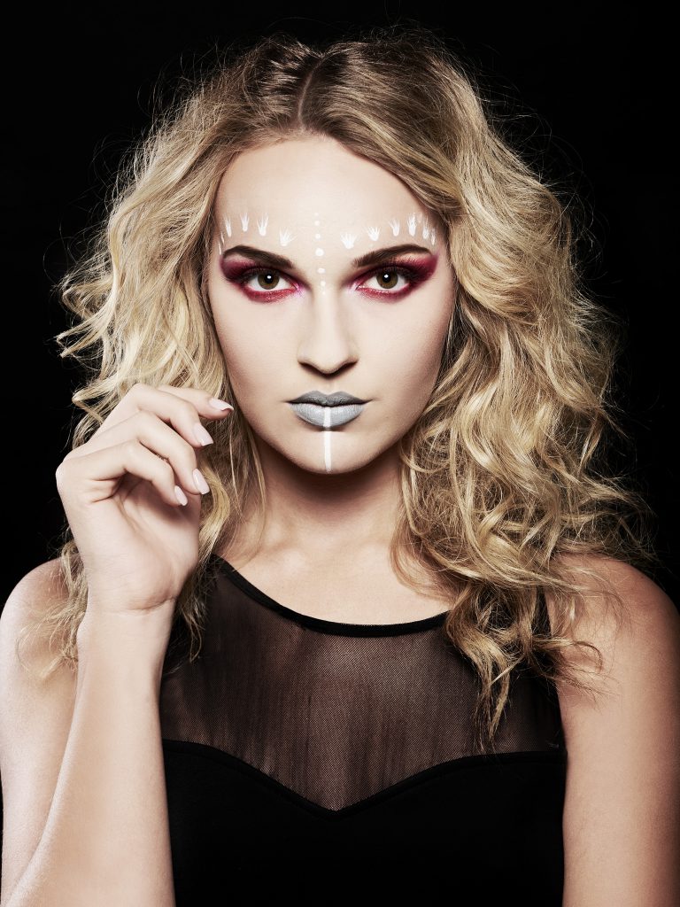 High Fashion model with tribal makeup